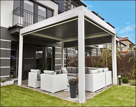 Aluminum Louvered Pergola shown with Bone White Frame, Graphite Roof Blades, and retracted Sun Shades